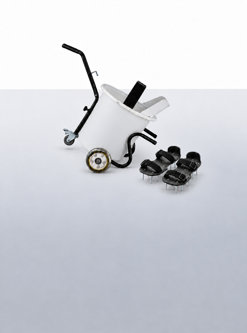 Wheeled mixing bucket cart and a pair of black strap-on spiked shoes for self-leveling floors.