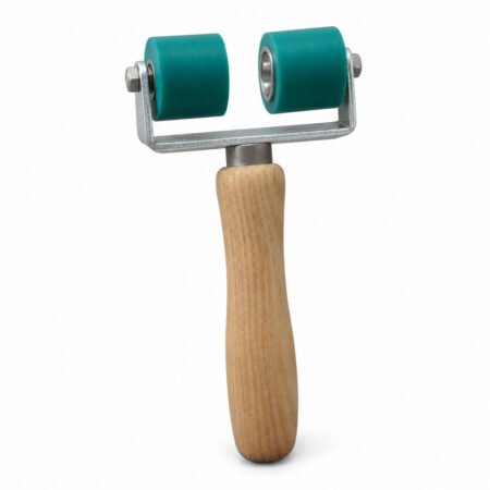 Angled detail view of the R011 28 + 28 mm Green Twin-Wheel Flooring Pressure Roller.